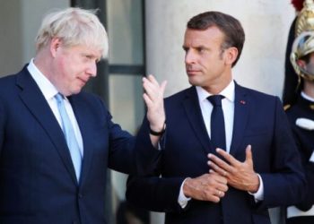 French President Emmanuel Macron and Britain's Prime Minister Boris Johnson gesture after their meeting at the Elysee Palace, Thursday, Aug. 22, 2019 in Paris. Boris Johnson traveled to Berlin Wednesday to meet with Chancellor Angela Merkel before heading to Paris to meet with French President Emmanuel Macron. (AP Photo/Daniel Cole)