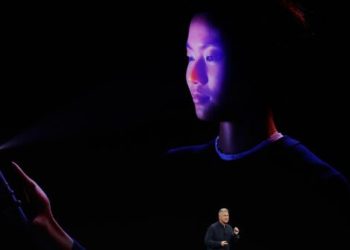 Phil Schiller, Apple's senior vice president of worldwide marketing, announces features of the new iPhone X at the Steve Jobs Theater on the new Apple campus on Tuesday, Sept. 12, 2017, in Cupertino, Calif. (AP Photo/Marcio Jose Sanchez)