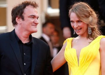 Director Quentin Tarantino (L) and actress Uma Thurman pose on the red carpet they arrive for the screening of the film "Sils Maria" (Clouds of Sils Maria) in competition at the 67th Cannes Film Festival in Cannes May 23, 2014. The film "Pulp Fiction" will be presented on Friday during a beach front cinema screening for its 20th anniversary.                      REUTERS/Benoit Tessier (FRANCE  - Tags: ENTERTAINMENT)   - LR2EA5N1CBEIJ