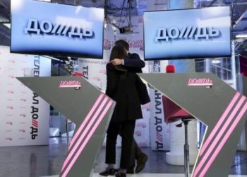 epa04054500 Russian TV Rain General Director Natalia Sindeyeva (L) and its main investor Alexander Vinokurov (R) embrace each other while leaving a studio after a live news conference in the company studio in Moscow, Russia, 04 February 2014. Natalia Sindeyeva said that they probably will ask President Vladimir Putin for an involvement in a bid to save the liberal TV channel. TV Rain is an  independent and private TV channel, that has gained big popularity in Russia, covering controversial topics of Russian political life. The crisis at the tv station was mainly caused by a controversial opinion poll where TV Rain asked Russians whether Leningrad (St Petersburg) should have been surrendered to German troops during the WWII blockade to save lives. The last major satellite TV operator, Trikolor, then switched TV Rain signal off and excluded them from their TV channel packages. Several other television companies also have dropped TV Rain.  EPA/SERGEI CHIRIKOV