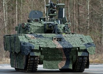 Pictured is the new AJAX prototype shown near its future assembly site in Merthyr Tydfil, Wales.

AJAX provides a step-change in the Armoured Fighting Vehicle capability being delivered to the British Army.

The programme includes six variants: AJAX, ARES, APOLLO, ATHENA, ATLAS and ARGUS. Each AJAX variant will be an agile, tracked, medium-weight armoured fighting vehicle, providing British troops with state-of-the-art best-in-class protection.

The vehicles are developed upon an adaptable and capable Common Base Platform, maximising commonality in mobility, electronic architecture and survivability that ensures the British Army has a family of world-class platforms.

Each AJAX platform variant has extensive capabilities, including acoustic detectors, a laser warning system, a local situational awareness system, an electronic countermeasure system, a route marking system, an advanced electronic architecture and a high performance power pack.

The AJAX family of vehicles has growth built in. With an upper design limit of 42 tonnes of driveline capability, scalable and open electronic architecture and a modular armour system, it has enormous potential to combat future threats and incorporate new technology throughout the lifespan of the platform.
As a result, AJAX provides the kind of growth capability that the user will need to face the uncertain challenges of Future Force 2020 and beyond. AJAX will replace the less capable CVR(T), providing broad utility throughout the balanced Army 2020 force across all operations.

The AJAX programme was originally known as the SCOUT Specialist Vehicle (SV) programme. It was renamed at DSEI (Defence Systems & Equipment International) exhibition on 15 September 2015.

Ultimately there will be 589 SCOUT SV platforms supplied to the British Army.