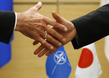 NATO Secretary-General Anders Fogh Rasmussen (L) shakes hands with Japan's Prime Minister Shinzo Abe after they exchange documents of joint political declaration between Japan and NATO during a signing ceremony at Abe's official residence in Tokyo April 15, 2013.   REUTERS/Toru Hanai (JAPAN - Tags: POLITICS MILITARY)
