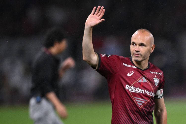 Vissel Kobe's Andres Iniesta waves after the end of the football friendly between Japan's Vissel Kobe and Spanish side Barcelona at the Japan National Stadium in Tokyo on June 6, 2023. (Photo by Philip FONG / AFP)
