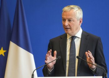 French Finance Minister Bruno Le Maire gestures as he speaks during a media conference after a meeting in Paris, Monday, Feb. 7, 2022. (AP Photo/Michel Euler)