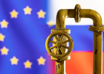 A model of the natural gas pipeline is seen in front of displayed word EU and Russia flag colours in this illustration taken March 8, 2022. REUTERS/Dado Ruvic/Illustration