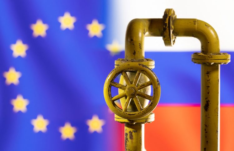 A model of the natural gas pipeline is seen in front of displayed word EU and Russia flag colours in this illustration taken March 8, 2022. REUTERS/Dado Ruvic/Illustration